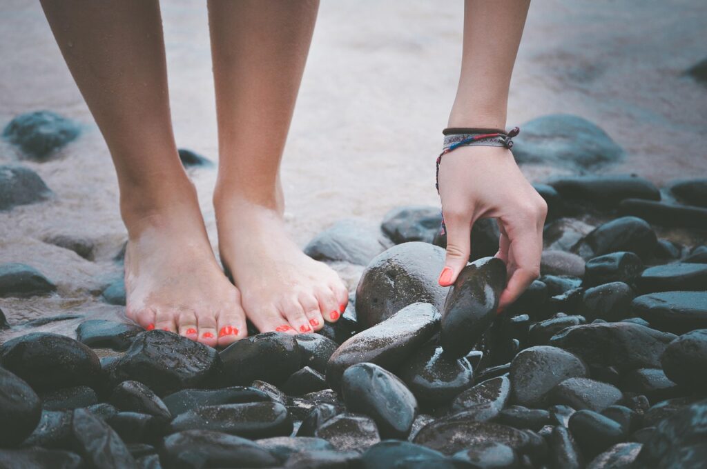 Woman with bare feet doing grounding.
